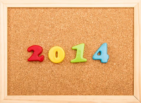 New year, 2014, written on a cork board.