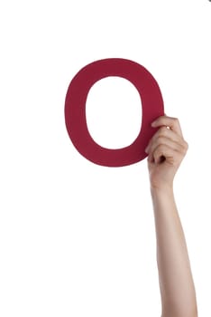 A Hand Holding the Red Letter O, Isolated