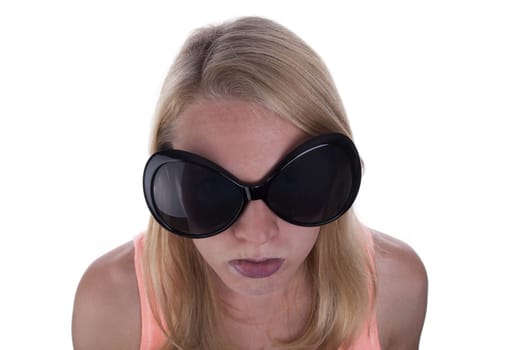 A Young Blond Teen With Huge Sunglasses Sulking, Isolated