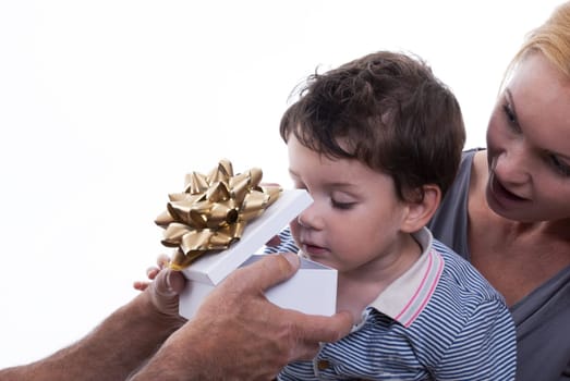 A Child With Mother Opens Astonished a Gift Box, Isolated
