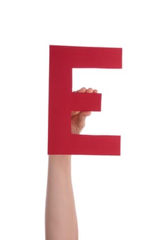 A Hand Holds a Red E, Isolated