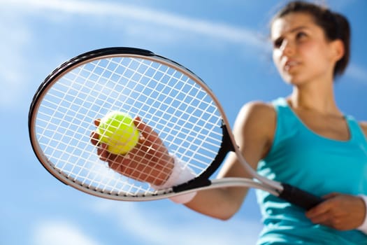 Young woman tennis player on the court