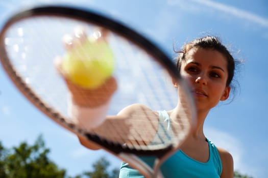 Young woman tennis player on the court