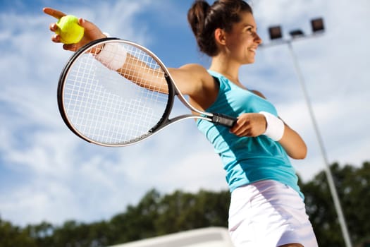 Young woman playing tennis
