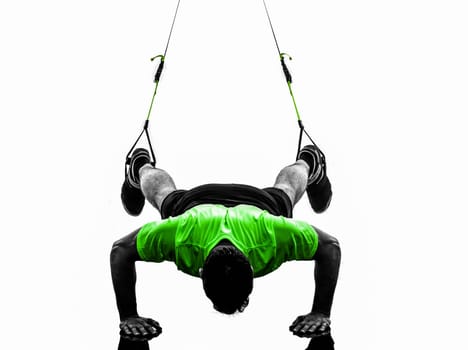 one caucasian man exercising   suspension training  trx   on white background