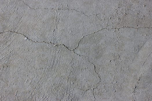 Grunge concrete cement wall with crack in industrial building