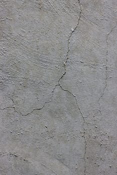 Grunge concrete cement wall with crack in industrial building