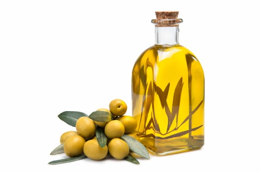 A jar with olive oil and some green olives isolated over a white background.