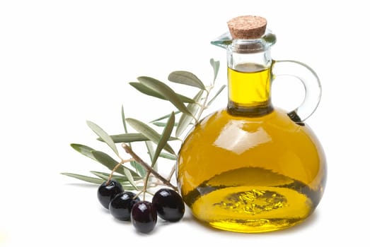 A jar with olive oil and some black olives isolated over a white background..