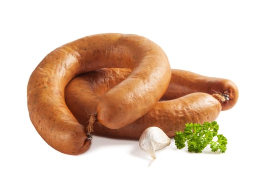 Smoked sausage with garlic and parsley isolated on white