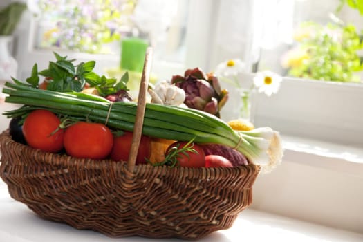 Vegetables in the basket isolated to white