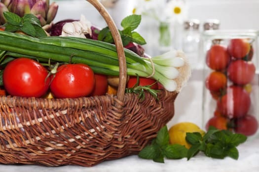 Vegetables in the basket isolated to white