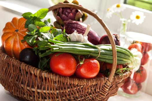 Vegetables in the basket isolated to white