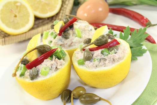lemons stuffed with tuna cream and capers