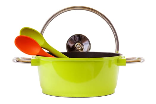 Green cooking pot and wooden spoon insulated on white