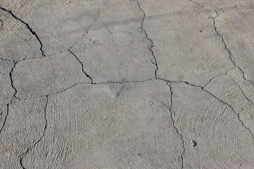 Grunge concrete cement wall with crack in industrial building