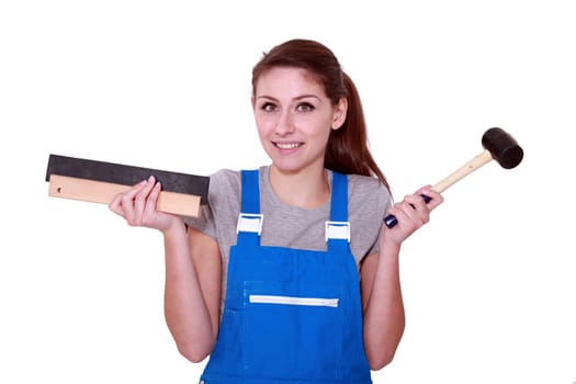 female worker holding hammer