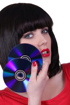 Sexy girl with CDs on white background