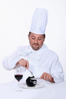 Chef cutting into his savings