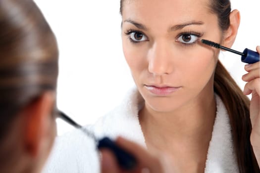 Woman applying eye make-up
