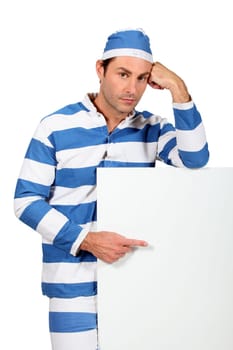 Prisoner pointing at white board
