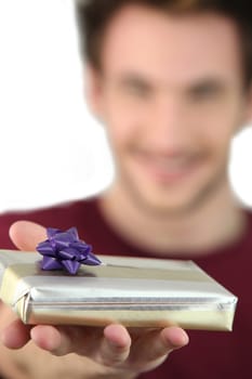 Man holding out a mystery gift
