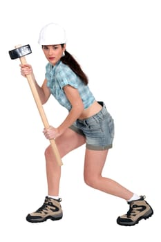 Female builder with hammer