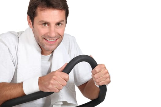 Man using a running machine in a gym