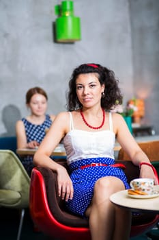 Woman on chair in café with cheerful smile