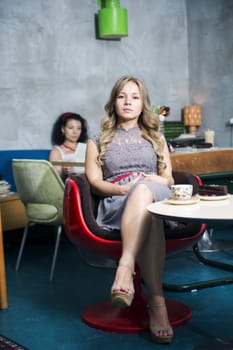 Woman rest at soft chair with demanding look