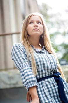 Woman in checkered dress dreaming about future events