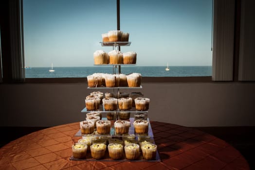Image of cupcakes on a tiered stand at a wedding