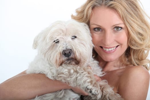 Woman with dog in arms.
