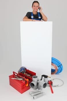 Female labourer with mobile telephone