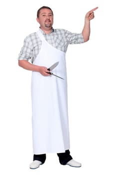 Male chef holding knife and pointing