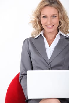 Smart executive woman using a laptop computer