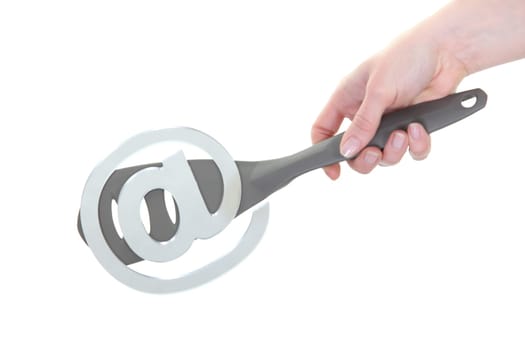 At symbol glued onto a spatula