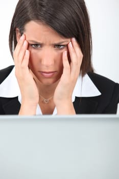 Businesswoman having computer problems