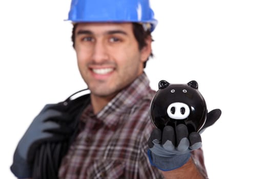 Electrician with a piggy bank