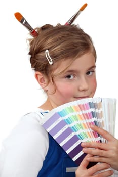 Girl holding a palette of colour samples