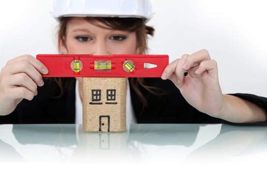 Woman using spirit level