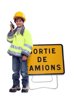 Young boy pretending to be a traffic guard