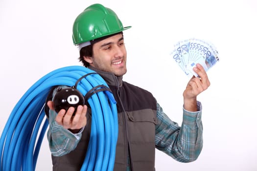 Plumber holding his wages