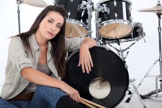 Woman posing with her drum set