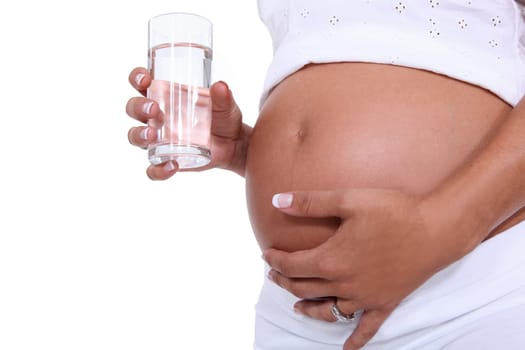 Pregnant woman holding a glass of water