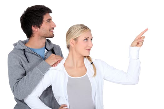 Couple pointing object