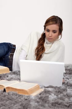 Young woman working on a university assignment