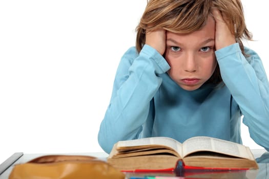 Boy exasperated with his homework
