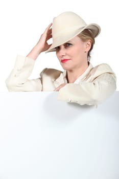 Woman holding hat