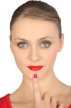 woman with red lipstick and red polished nails